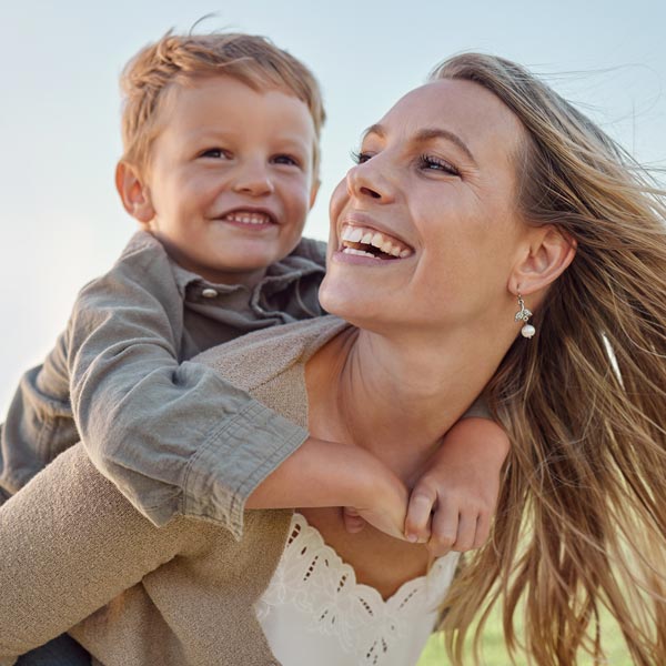 mother and son smiling